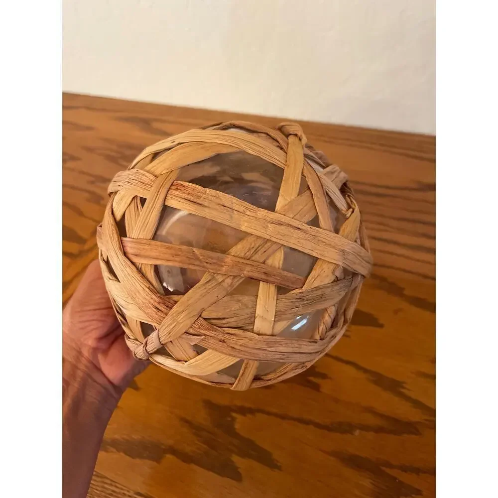Straw covered glass vase